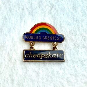 Vintage 1970s-1980s Worlds Greatest Cheapskate Rainbow Dangle Goldtone Lapel Pin